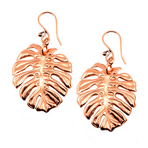 1 of 7: A Pair of Monstera Copper Leaf Earrings on a White Background