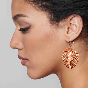 4 of 7: A Chic Woman Wearing Monstera Copper Leaf Earrings