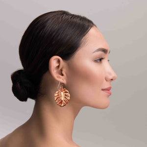 6 of 7: An Elegant Woman Wearing Monstera Copper Leaf Earrings