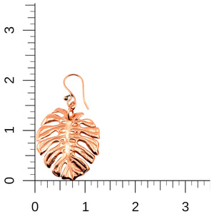 3 of 7: Monstera Copper Leaf Earrings on a Ruler for Size Dimensions
