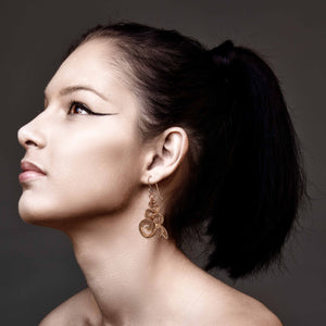 6 of 7: Stunning Woman Wearing Mystic Snake Copper Drop Earrings