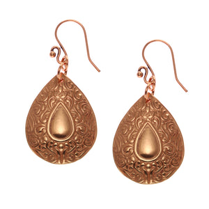 1 of 7: A Pair of Ornate Mandala Teardrop Copper Earrings on a White Background