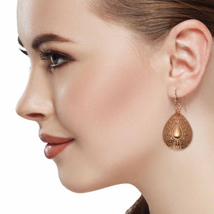 5 of 7: Elegant Woman Wearing Ornate Mandala Teardrop Copper Earrings 