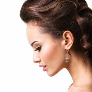 2 of 7: Stunning Woman Wearing Ornate Mandala Teardrop Copper Earrings 