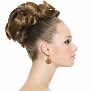 2 of 7: Elegant Woman Wearing Paisley Burst Copper Drop Earrings
