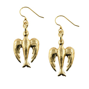 1 of 7: Handcrafted Nu Gold brass dangle earrings featuring a detailed peace dove design with French ear wires and a warm golden finish.