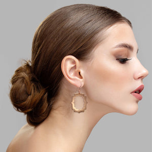6 of 7: Elegant Woman Wearing Pierced Hammered Copper Arabesque Shield Earrings