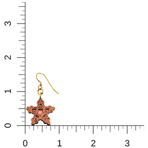 5 of 7: Small Copper Snowflake Dangle Earring on a ruler for scale