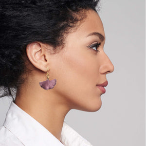 4 of 8: Chic Woman in White Blouse Wearing Small Mauve Ginkgo Leaf Anodized Aluminum Purple Earrings