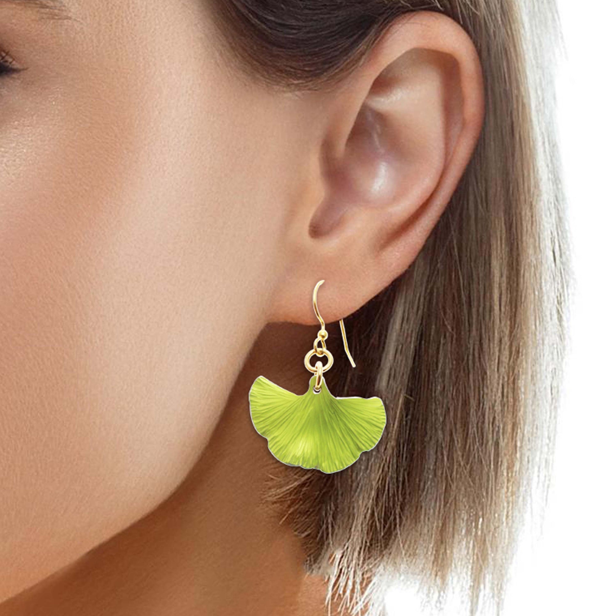Side Profile of a Woman Wearing Small Ginkgo Leaf Anodized Aluminum Sour Candy Apple Earrings