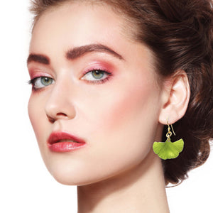 8 of 9: Elegant Redhead Female Model Wearing Small Ginkgo Leaf Anodized Aluminum Sour Candy Apple Earrings