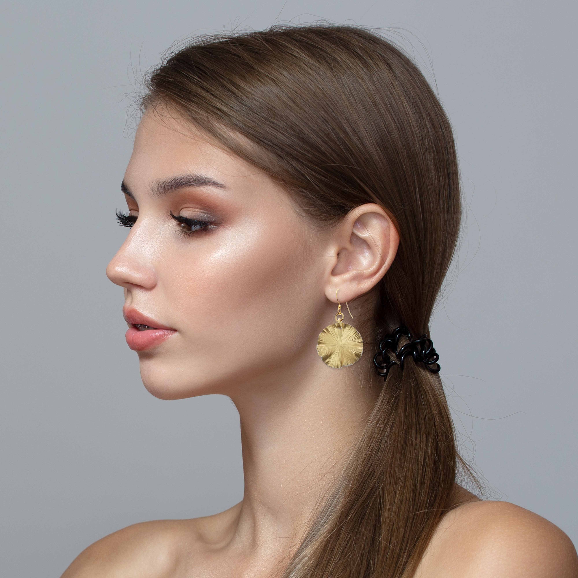 Elegant Women Wearing Small Gold Anodized Lily Pad Leaf Drop Earrings