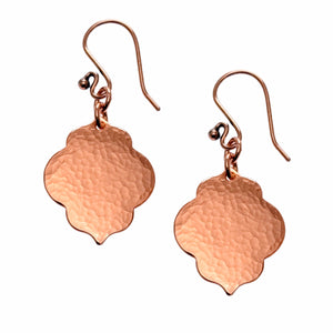 1 of 7: A Pair of Small Hammered Copper Quatrefoil Dangle Earrings on a White Background
