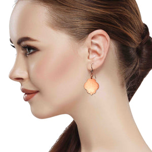 2 of 7: An Elegant Woman Wearing Small Hammered Copper Quatrefoil Dangle Earrings