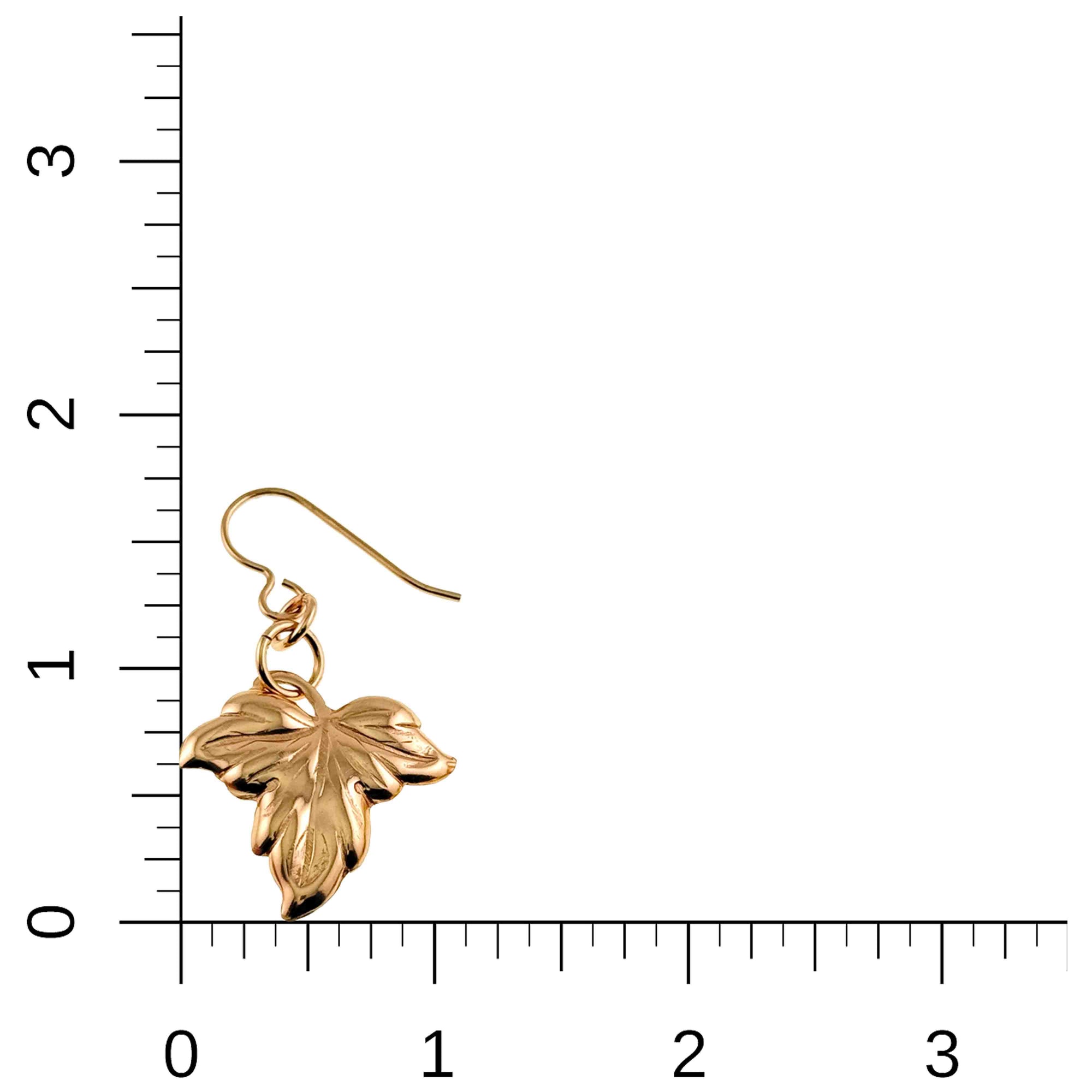 Small Maple Leaf Bronze Dangle Earring on a ruler for size reference