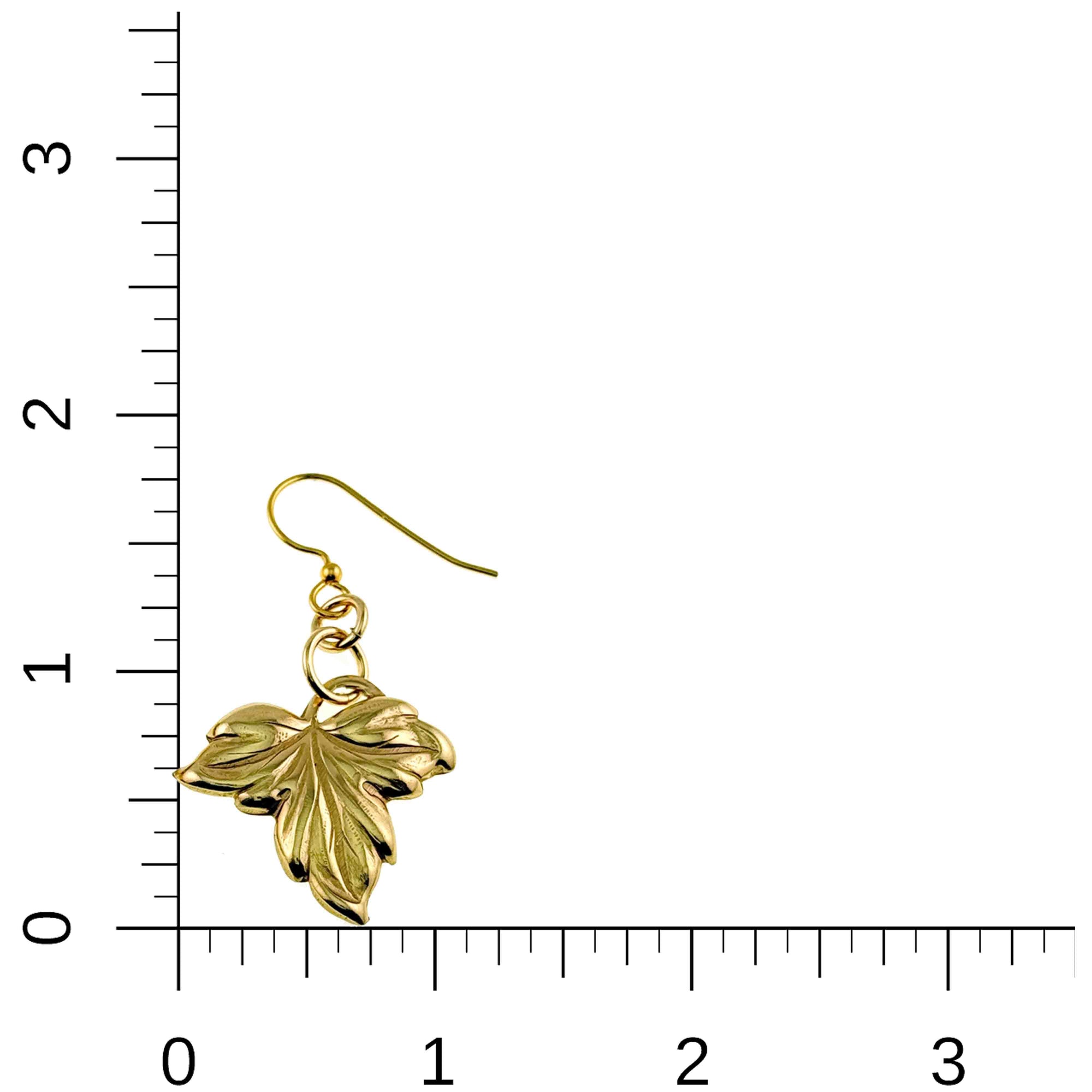 Small Maple Leaf Nu Gold Brass Dangle Earring on a ruler for scale