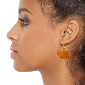 4 of 7: A Fashionable Woman Wearing Small Orange Anodized Aluminum Ginkgo Leaf Earrings