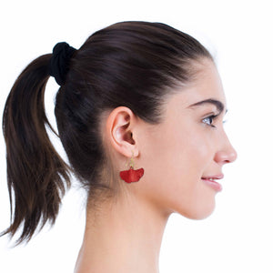 6 of 7: A Chic Woman WIth a Ponytail Wearing Small Red Ginkgo Leaf Anodized Aluminum Earrings 