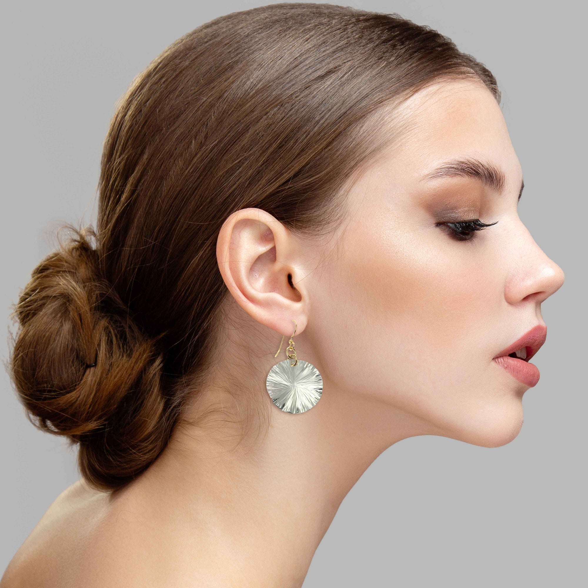 An Elegant Woman Wearing Small Aluminum Lily Pad Leaf Drop Earrings