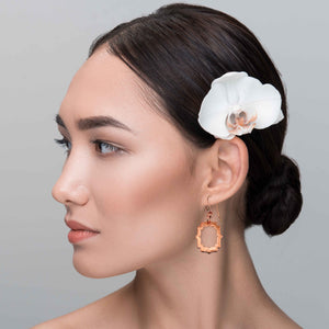 4 of 7: An Elegant Woman Wearing Small Pierced Hammered Copper Arabesque Shield Earrings