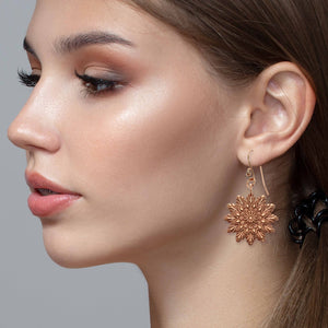 6 of 7: Fashionable Woman Wearing Starburst Mandala Copper Earrings 