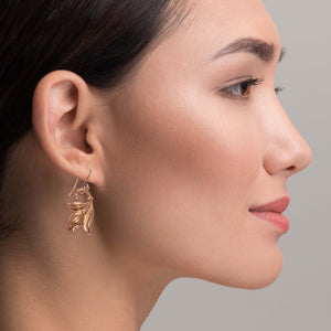 4 of 7: Stunning Woman Wearing Tulip Flower Copper Dangle Earrings