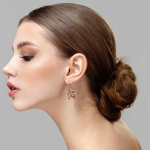 6 of 7: Fashionable Woman Wearing Tulip Flower Copper Dangle Earrings