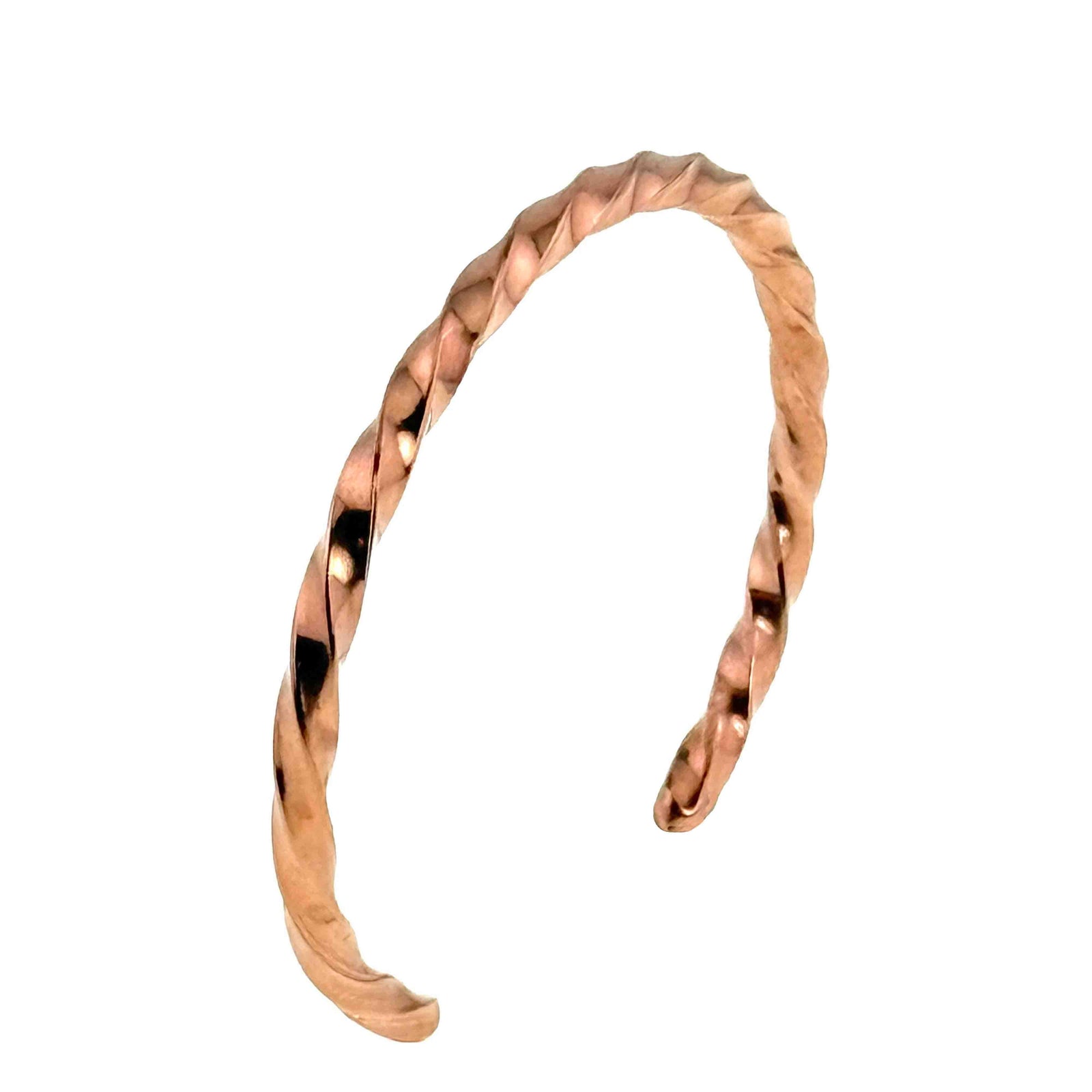 Slim twisted copper cuff bracelet shown against a white background, photographed from the side to highlight its open-ended shape and spiral design. The solid copper band features a continuous twisted pattern with softly faceted edges that catch the light, creating alternating highlights and shadowed grooves along the surface. The warm copper tone and narrow profile give the bracelet a lightweight, minimalist look, suitable for stacking or wearing alone for a subtle handcrafted accent on the wrist.