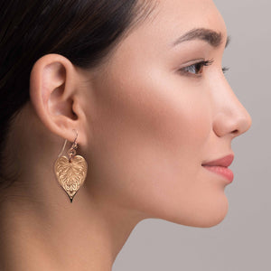 4 of 7: Stylish Woman Wearing Victorian Copper Heart Leaf Drop Earrings