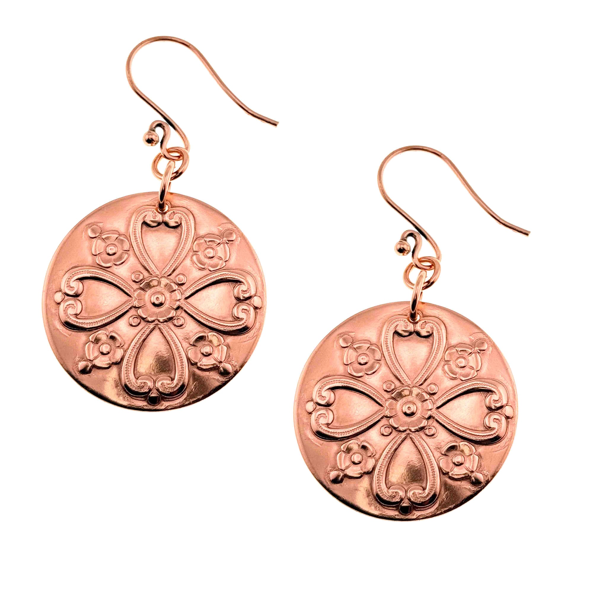 A Pair of Victorian Flower Copper Disc Earrings on a White Background