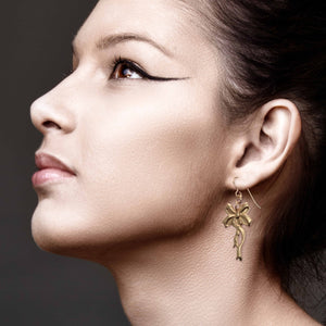 4 of 7: Stunning Woman Wearing Yuletide Ribbon Bronze Dangle Earrings