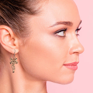 2 of 7: Stylish Woman Wearing Yuletide Ribbon Copper Dangle Earrings