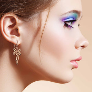 5 of 7: Elegant Woman Wearing Yuletide Ribbon Copper Dangle Earrings