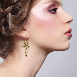 6 of 7: Stunning Woman Wearing Yuletide Ribbon Nu Gold Brass Dangle Earrings