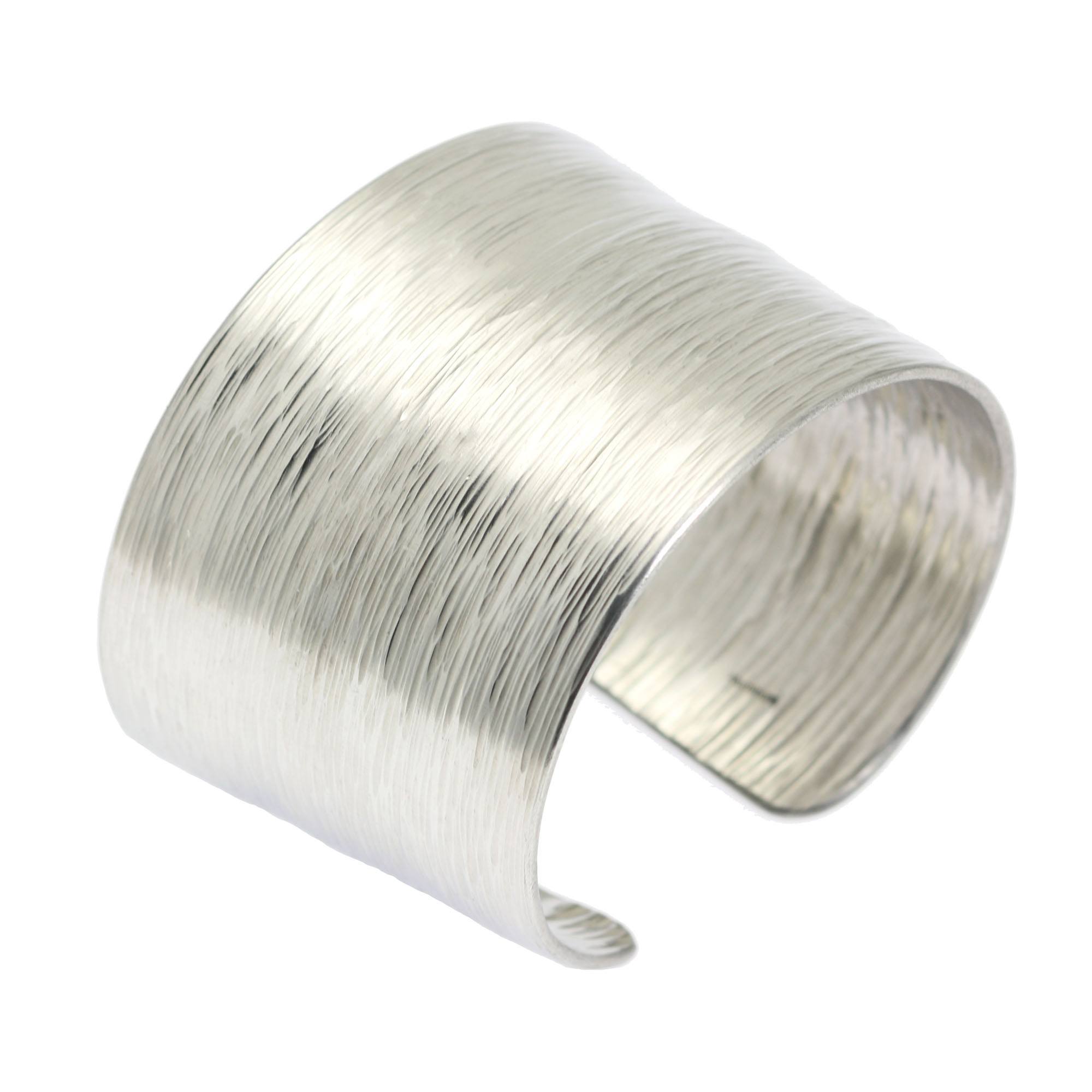 An Aluminum Bark Cuff Bracelet on a White Background