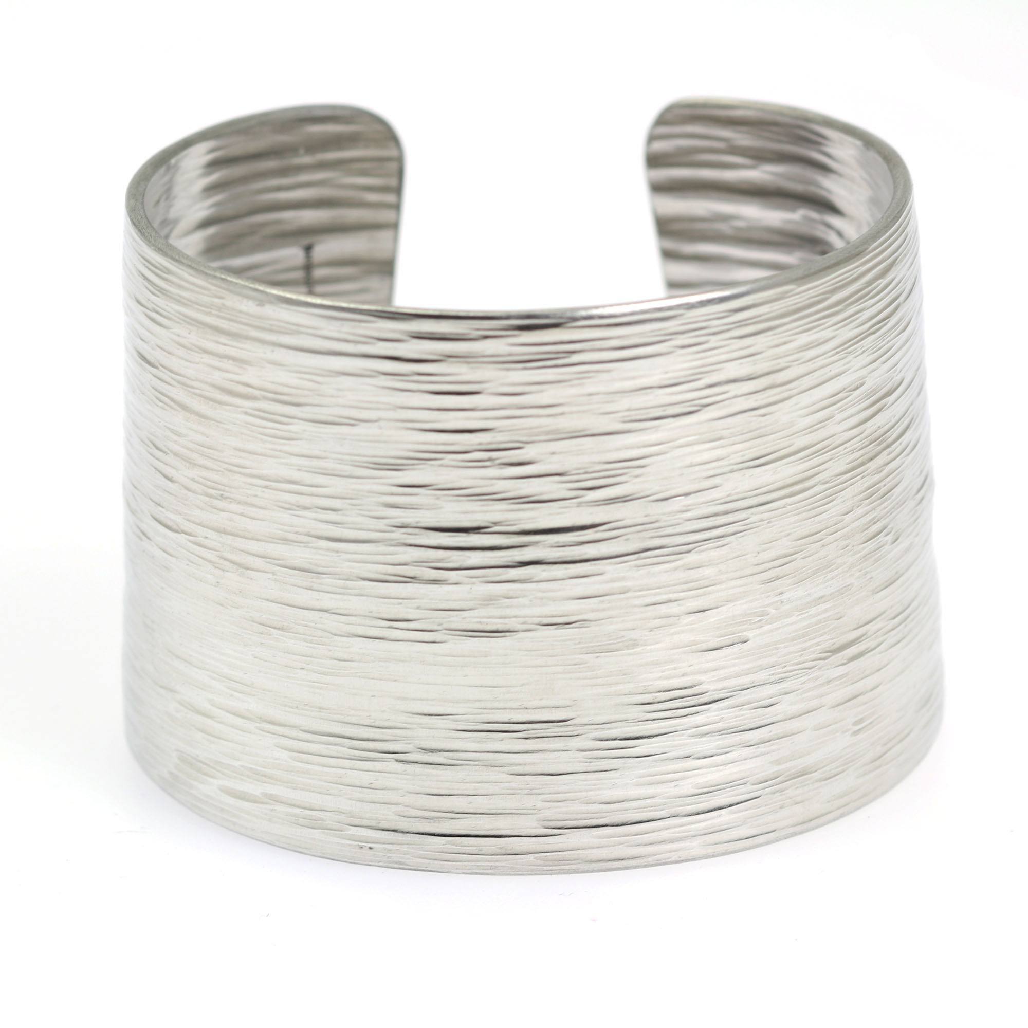 Side Detail of Aluminum Bark Cuff on a White Background