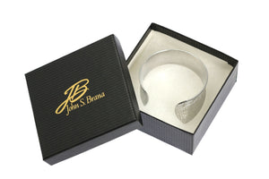 6 of 7: Anticlastic Tapered Linen Aluminum Bangle Bracelet in a Black Gift Box with Gold Logo