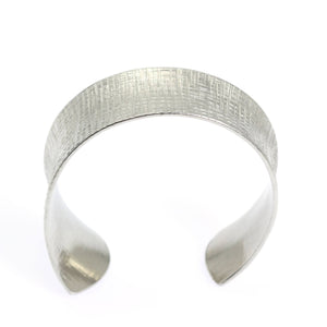 3 of 7: Shape of Anticlastic Tapered Linen Aluminum Bangle Bracelet