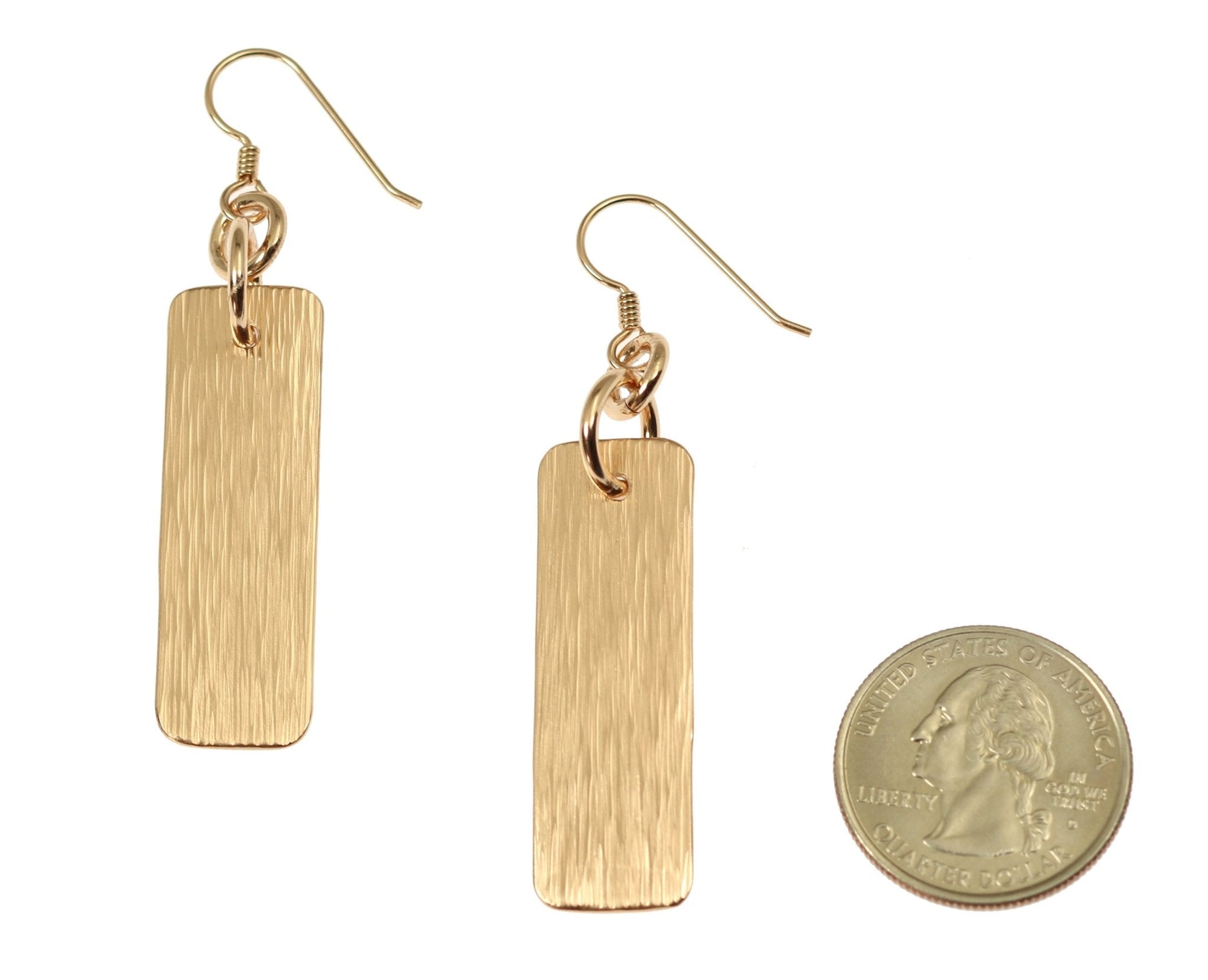 Size of Bronze Bark Dangle Earrings compared to a US Quarter Coin