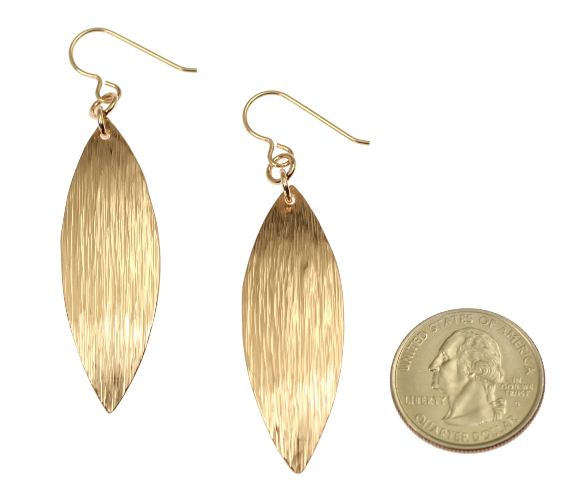 Size of Bronze Bark Leaf Drop Earrings compared to a US Quarter Coin