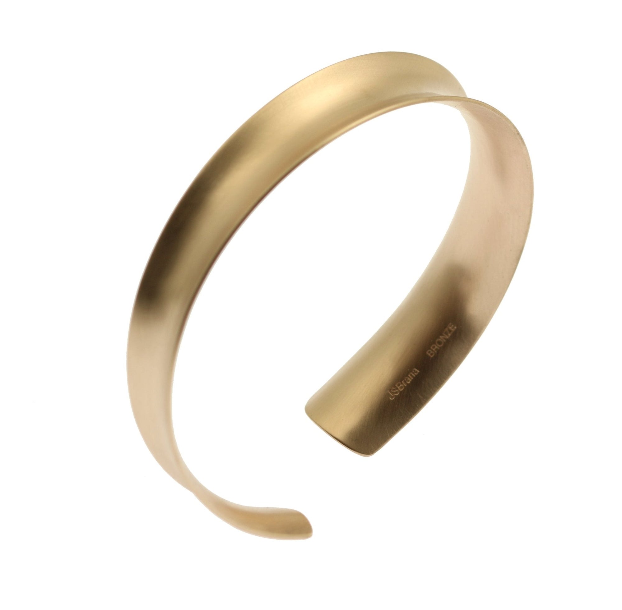 A Brushed Bronze Anticlastic Bangle Bracelet on a White Background