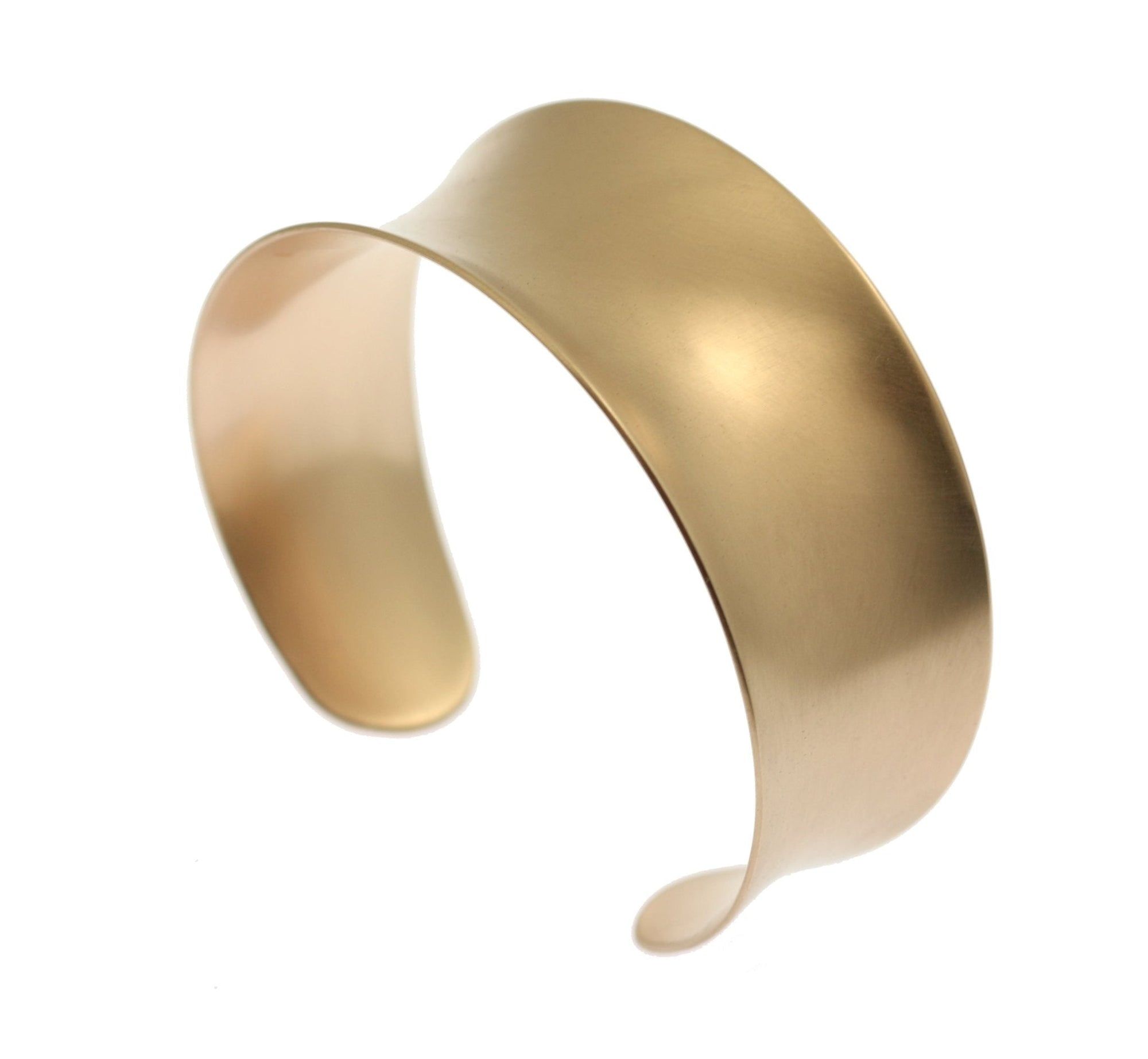 A wide, handcrafted brass cuff bracelet with a smooth satin finish and softly curved edges. The bracelet features a flared, concave design that gently tapers at the ends, giving it a sculptural and modern look. Its warm golden tone adds a touch of elegance and sophistication. The open-ended style allows for easy adjustment and a comfortable fit on the wrist. Photographed against a plain white background to highlight the bracelet’s clean lines and polished surface.