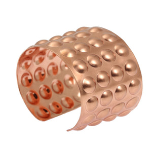 1 of 7: A Brushed Copper Bubble Wrap Cuff Bracelet on a White Background