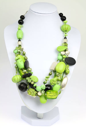 1 of 6: A Chalk Turquoise Beaded Gemstone Necklace on a White Neck Display