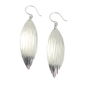 1 of 4: A Pair of Chased Aluminum Leaf Drop Earrings on a White Background