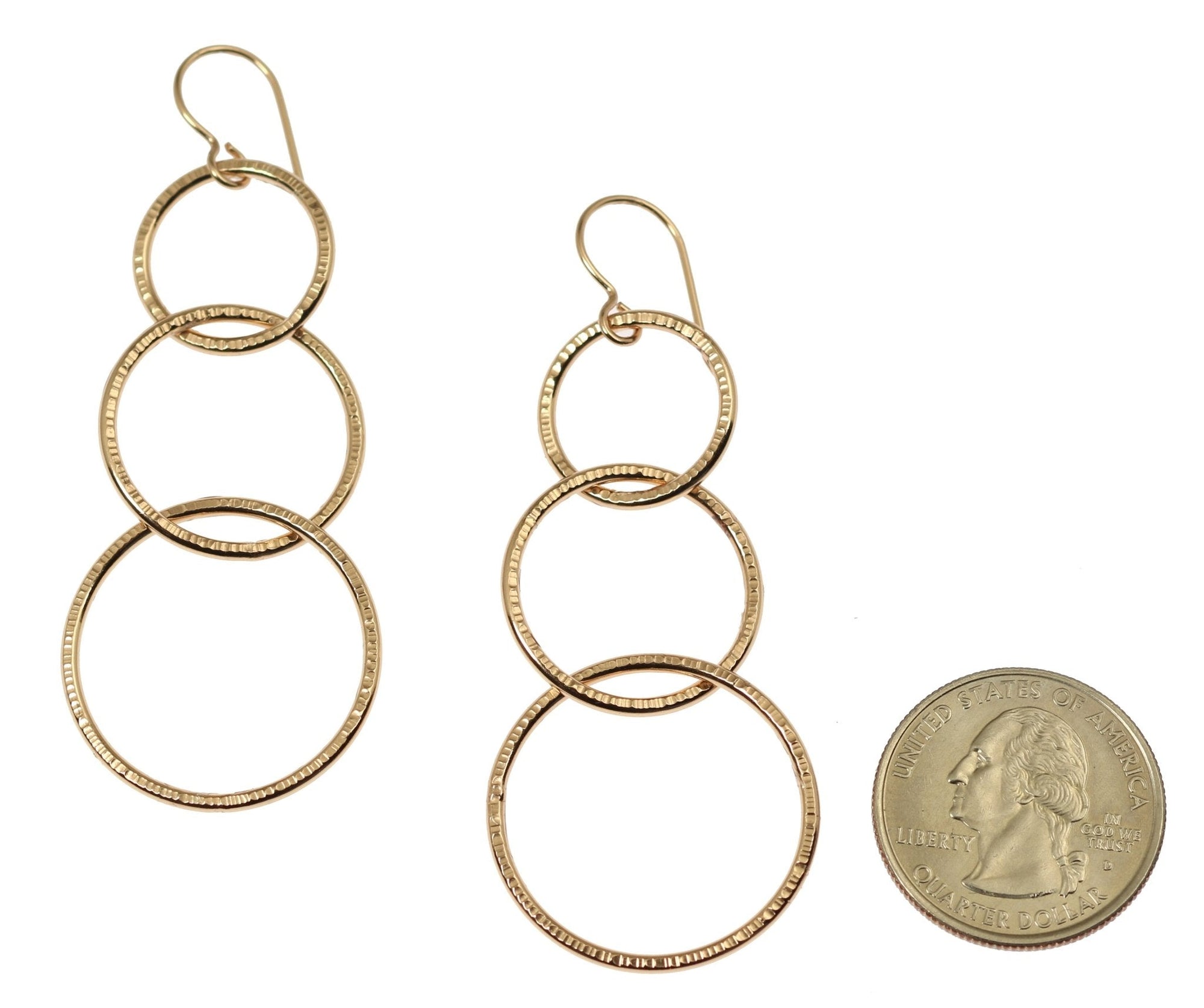 Size of Chased Bronze Three Tiered Dangle Earrings compared to a US Quarter Coin