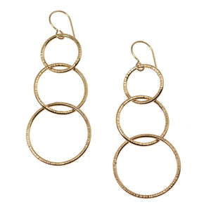 1 of 5: A Pair of Chased Bronze Three Tiered Dangle Earrings on a White Background