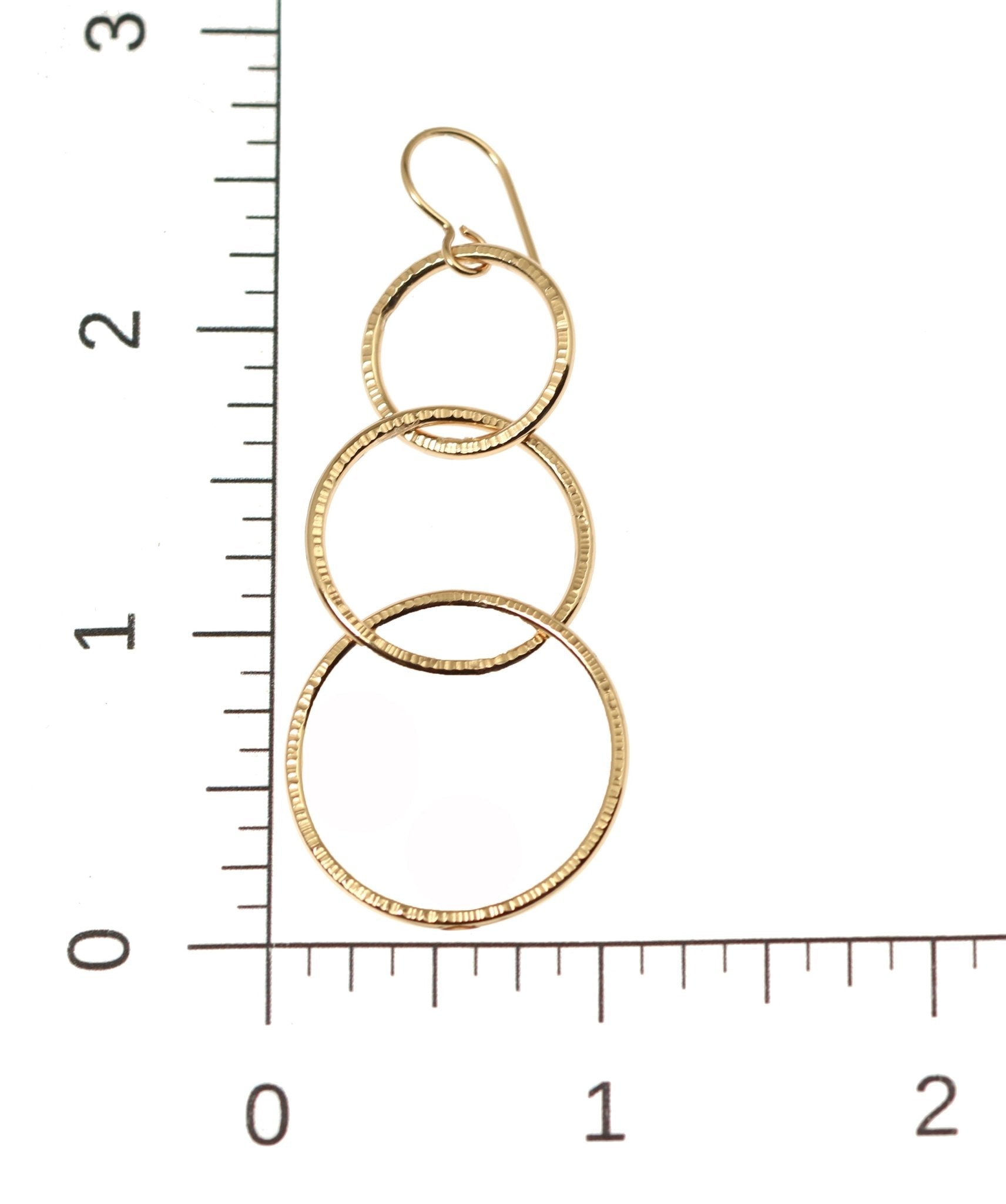 Scale of Chased Bronze Three Tiered Dangle Earrings on a Ruler for Size Dimensions