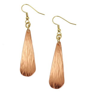 1 of 3: A Pair of Chased Copper Long Teardrop Earrings on a White Background