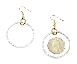 3 of 7: Size of Chased Rim Aluminum Hoop Earrings compared to a US Quarter Coin